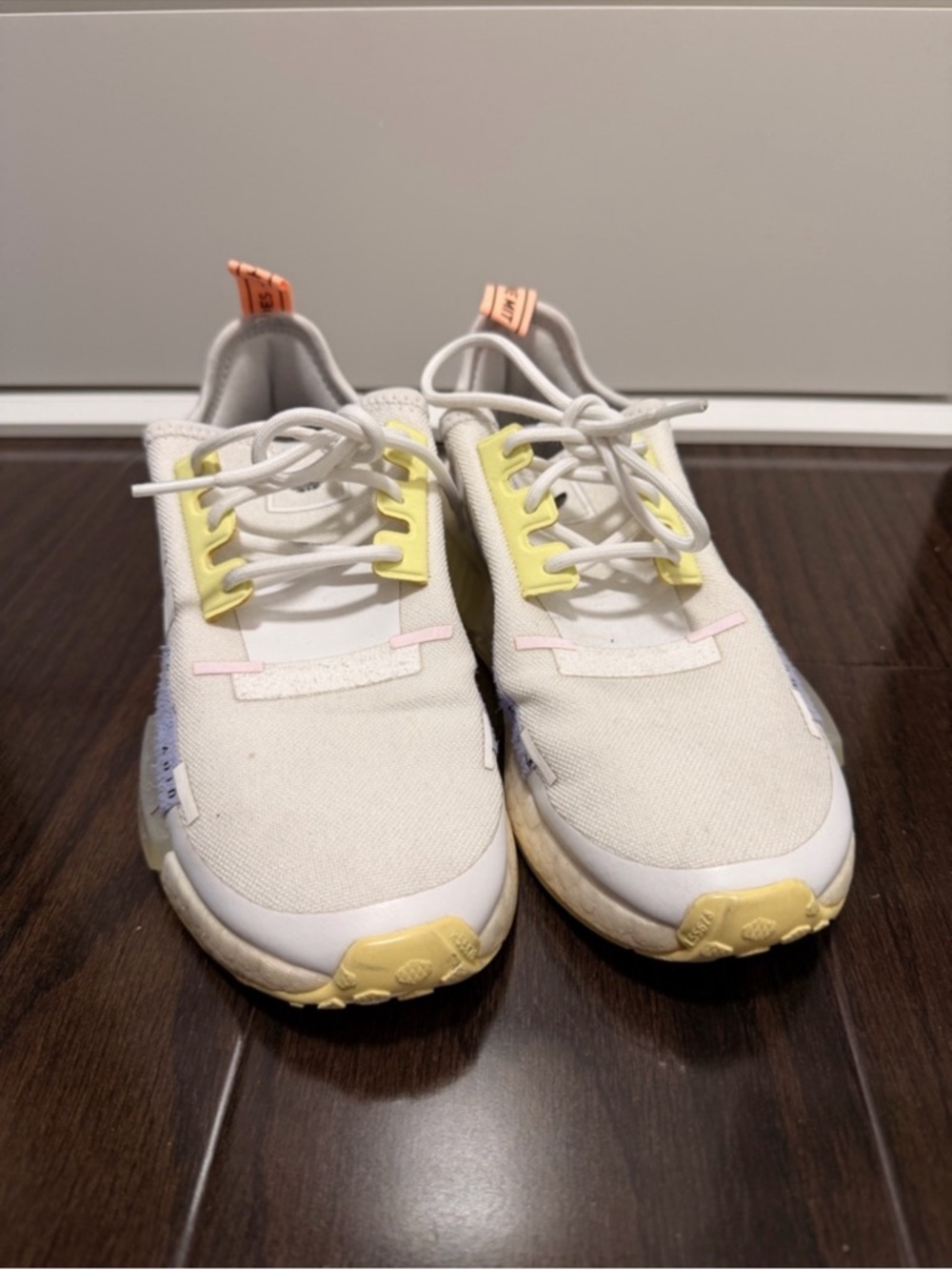 White Athletic Sneakers with Pastel Yellow and Pink Accents